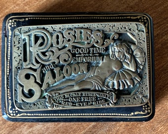 Vintage solid brass belt buckle "Rosie's Good Time Emporium and Saloon". Rare! In excellent condition.