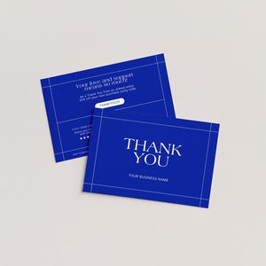 May include: Two blue business thank you cards with white text. One card reads "THANK YOU" and "YOUR BUSINESS NAME". The other card has the text "Your love and support means so much!" and "20% off your next purchase using code".