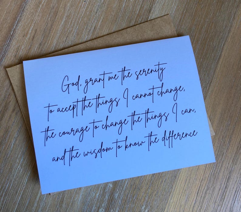 May include: A white rectangular greeting card featuring black cursive text that reads: God, grant me the serenity to accept the things I cannot change, the courage to change the things I can, and the wisdom to know the difference. A brown envelope is included.