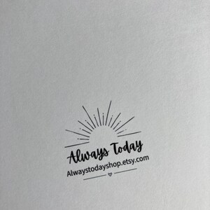 May include: A white paper surface featuring a black ink stamp design. The graphic includes a sunburst icon above the text Always Today, followed by the web address Alwaystodayshop.etsy.com and a small heart symbol centered between two horizontal lines.