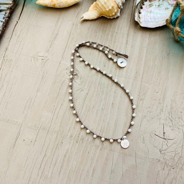 White mother of pearl crocheted necklace with silver starfish pendant