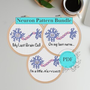 May include: A set of three cross-stitch patterns featuring cartoon neurons with funny sayings. The patterns are titled "My Last Brain Cell", "On my last nerve...", and "I'm a little Nervous".