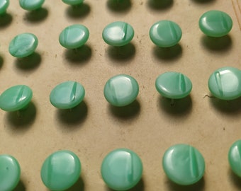 Card of 36 small glass buttons, pale green 9mm