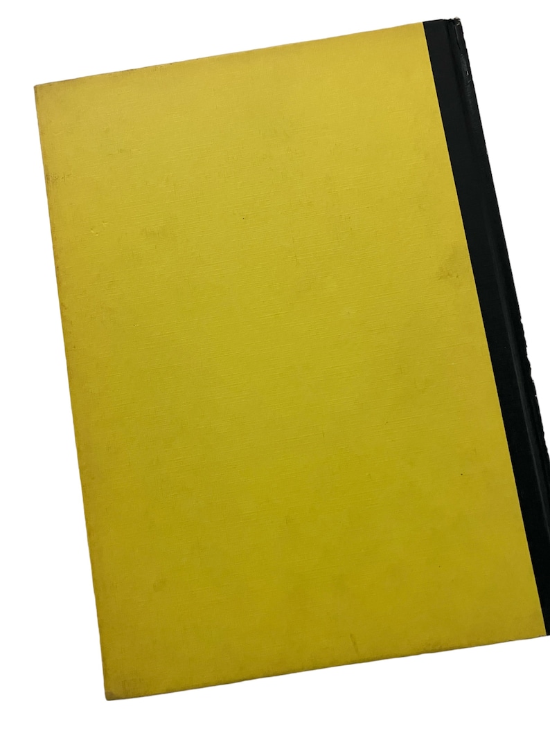 May include: A yellow hardback book with a black spine.