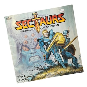 May include: A vintage Sectaurs storybook cover featuring two armored warriors with swords and shields. The title "SECTAURS WARRIORS OF SYMBION" is prominently displayed. The cover art includes a large blue monster and the text "MISSION OF FRIENDSHIP".