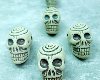 Unglazed spiral skull