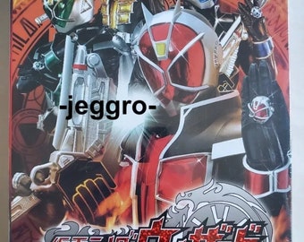 May include: DVD box set for the Japanese television series Kamen Rider Wizard. The box art features the main character, Kamen Rider Wizard, in his red and black suit, along with other characters from the series. The text on the box reads "Kamen Rider Wizard Vol. 1-53 End + The Movie: In Magic Land".