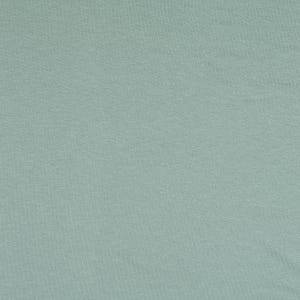 Könnte beinhalten: Ein einfarbiger, helltürkisfarbener Stoff mit einer dezenten Textur. Das Material hat ein weiches, mattes Aussehen, und die Farbe ist über die gesamte Oberfläche gleichmäßig. Der Stoff scheint ein mittleres Gewicht zu haben, geeignet für verschiedene Nähprojekte.