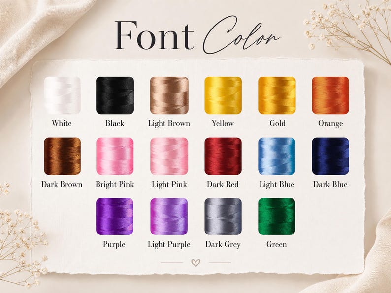 May include: A colour chart titled Font Color displaying eighteen individual spools of embroidery thread in various shades including white, black, light brown, yellow, gold, orange, dark brown, bright pink, light pink, dark red, light blue, dark blue, purple, light purple, dark grey, and green.