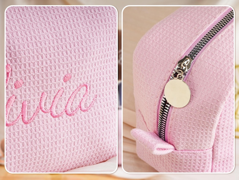 May include: A light pink waffle-textured cosmetic bag featuring the embroidered name Olivia in a matching pink script font. The bag includes a silver-toned metal zip closure with a round, smooth, blank metal pull tab attached to the slider.