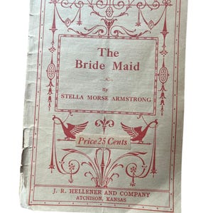 May include: A vintage playbill for a play called "The Bride Maid" by Stella Morse Armstrong. The playbill is printed on cream-colored paper with red text and decorative flourishes. The price is listed as 25 cents. The playbill is from J.R. Hellener and Company in Atchison, Kansas.