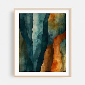 May include: Abstract watercolor art print in a light wood frame. The artwork features vertical, layered shapes in shades of teal, blue, orange, and brown, creating a textured, organic appearance. The color palette evokes a sense of depth and natural formations.