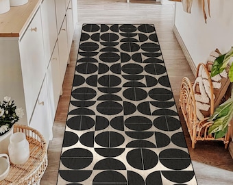 Alfombra de corredor geométrica moderna en blanco y negro: diseño circular llamativo, antideslizante, ideal para pasillos y entradas.