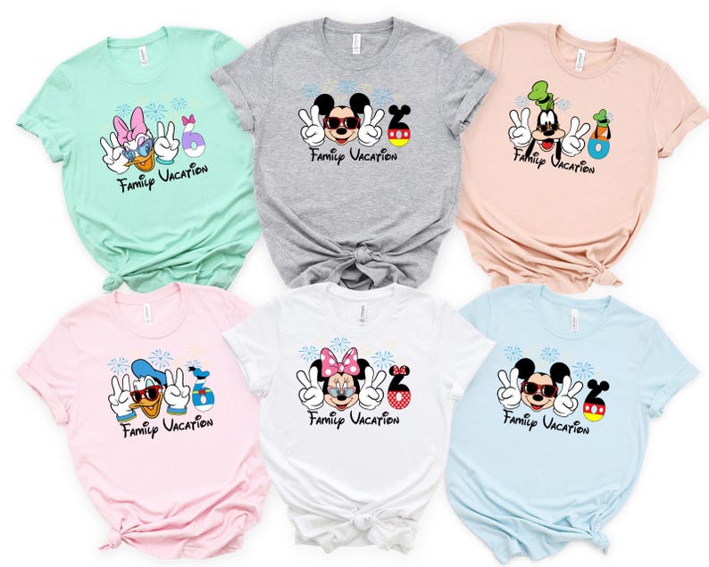 a collection of six t-shirts featuring Disney characters and the text "Family Vacation" printed on them.