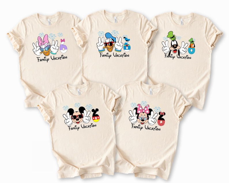 five beige t-shirts with various Disney character designs and the text "Family Vacation" printed on them.