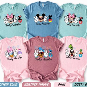 a collection of six t-shirts featuring Disney characters and the text "Family Vacation" printed on them.