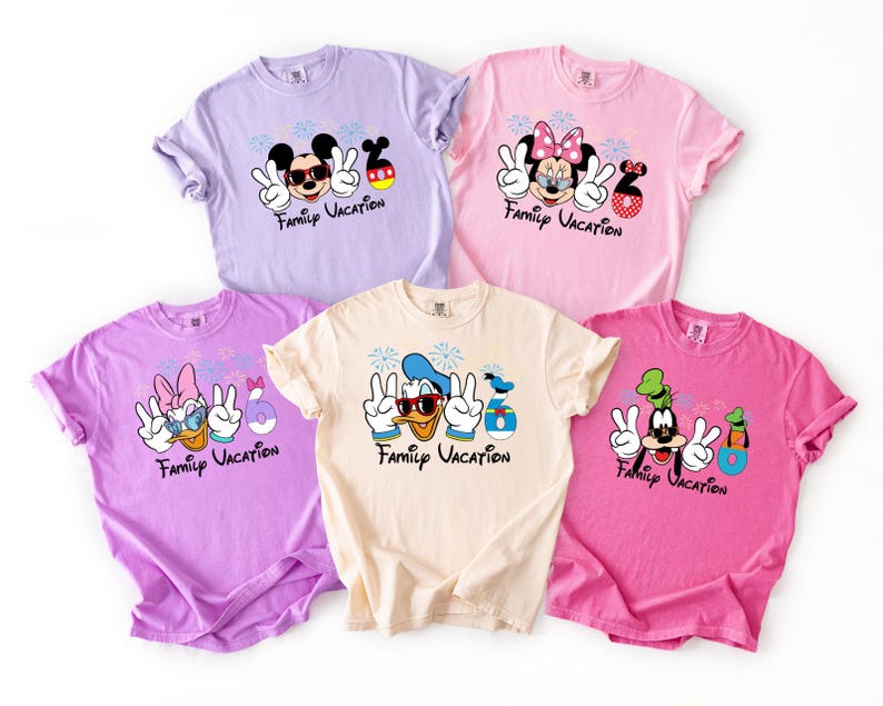five t-shirts with Disney characters and the text "Family Vacation" printed on them.