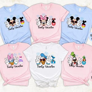 a collection of six t-shirts, each featuring a different Disney character and the text "Family Vacation" printed on them.