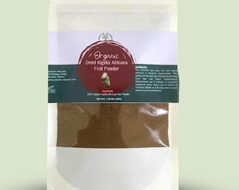 May include: A white pouch containing dried Kigelia Africana fruit powder. The pouch has a label with the text "Organic Dried Kigelia Africana Fruit Powder." The net weight is 1.76 oz (50g).