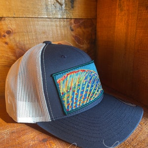 Andrea Larko Grayling Fin Embroidered Fly Fishing Trucker Snapbback Hat Side View on Navy with Gray Mesh Back
