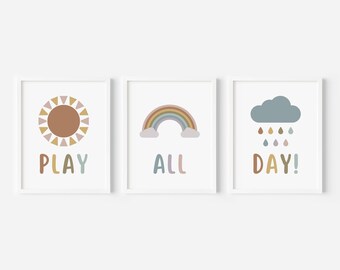 May include: Three framed prints with a sun, rainbow, and cloud with raindrops. The text on the prints reads "PLAY ALL DAY!"