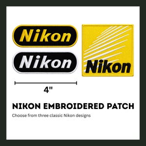 May include: Embroidered Nikon patches in three designs. One patch is a yellow rectangle with white lines and the Nikon logo. Two patches are oval-shaped with the Nikon logo in black and yellow or white and black. The patches are 4 inches in length.