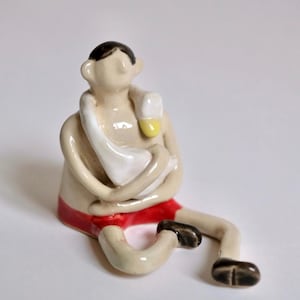 Handmade Ceramic Boy and Duck Sculpture: Unique Art Figurine