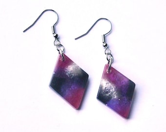 Purple, silver, black, and pink diamond-shaped resin dangle earrings