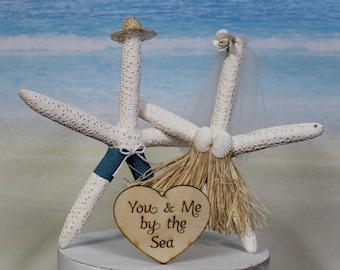 Adorno para pastel de boda con forma de estrella de mar en la playa, ideal para novios, destino único y divertido.