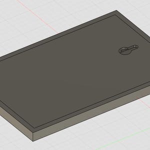 May include: A rectangular dark gray plaque with a beveled edge and a keyhole-shaped mounting slot centered near the top edge. The object has a flat, smooth surface and a solid, uniform appearance, presented in a three-dimensional digital render.