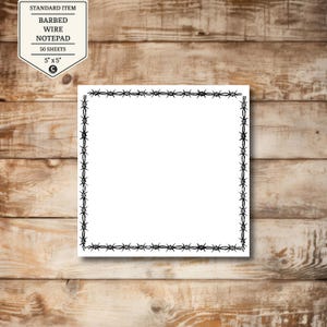 May include: White notepad with a black barbed wire border. The notepad is 5" x 5" and has the text "STANDARD ITEM BARBED WIRE NOTEPAD 50 SHEETS". The notepad is on a wooden surface.