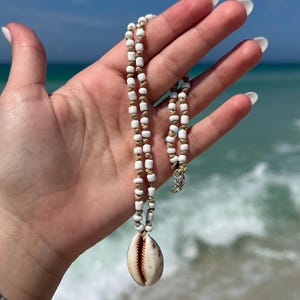 Hand beaded knotted cowrie shell necklace