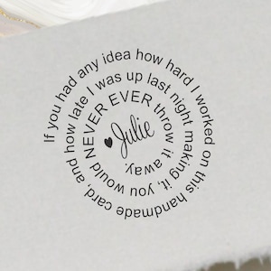 May include: A white handmade card with a circular black text design. The text reads "If you had any idea how hard I worked on this handmade card, and how late I was up last night making it, you would NEVER throw it away." The name "Julie" is in the center.