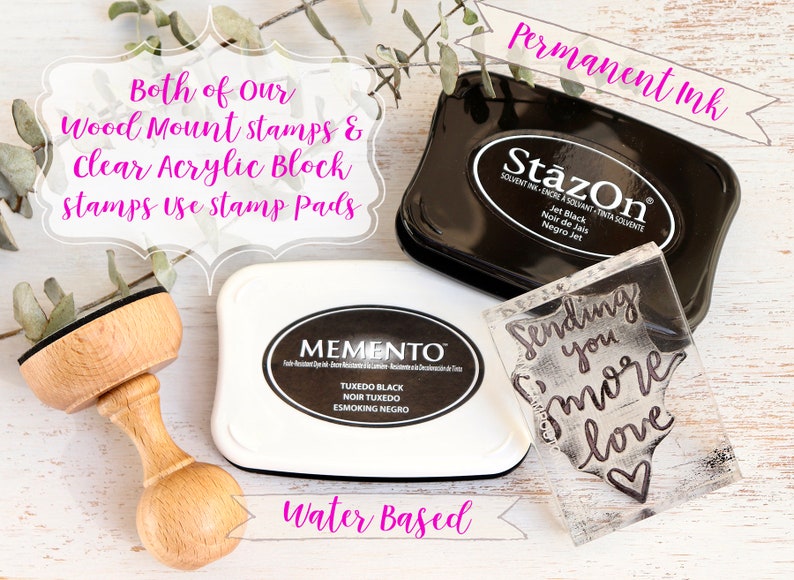 May include: Two ink pads, one black and one white, with the brand names "StazOn" and "Memento" printed on them. A clear acrylic stamp with the text "Sending you more love" is also shown. The text "Permanent Ink" and "Water Based" is written in pink on the image.