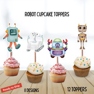 May include: Robot cupcake toppers with various robot designs, including a blue robot, a white robot, and a brown robot. The cupcakes have pink and white frosting with colorful sprinkles. The text "Robot Cupcake Toppers" is at the top.