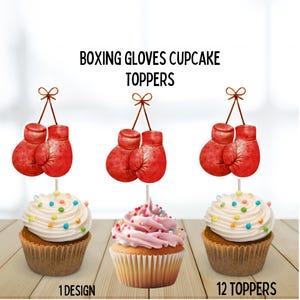 May include: Three cupcakes with white and pink frosting, topped with colorful sprinkles. Each cupcake has a red boxing glove topper. The text "BOXING GLOVES CUPCAKE TOPPERS" is above the cupcakes. The text "1 DESIGN" and "12 TOPPERS" is below the cupcakes.
