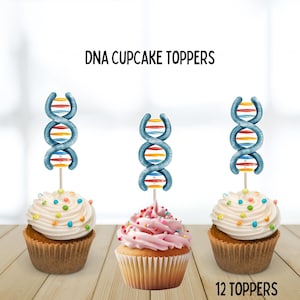 May include: Three cupcakes with white and pink frosting, topped with colorful sprinkles. Each cupcake has a DNA-shaped topper in blue, yellow, orange, and red. The text "DNA CUPCAKE TOPPERS" and "12 TOPPERS" are visible.