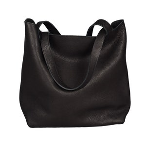 May include: A black leather tote bag with two shoulder straps.