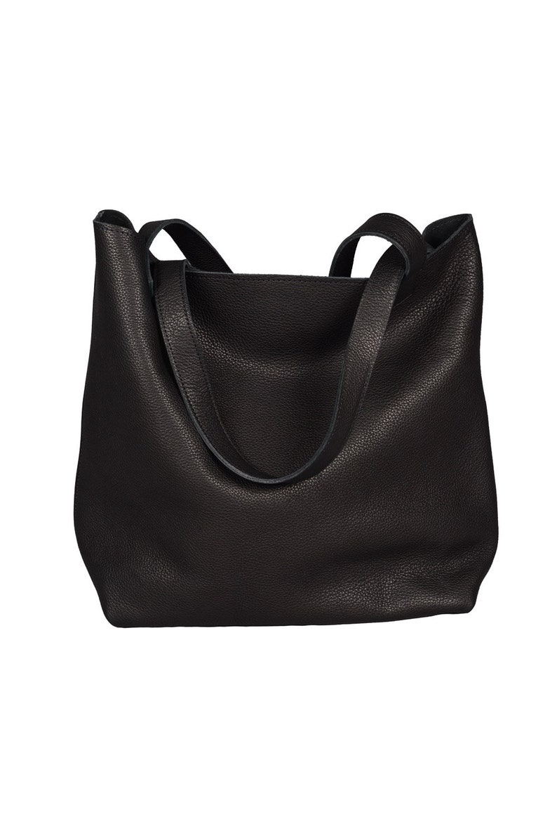 May include: A black leather tote bag with two shoulder straps.