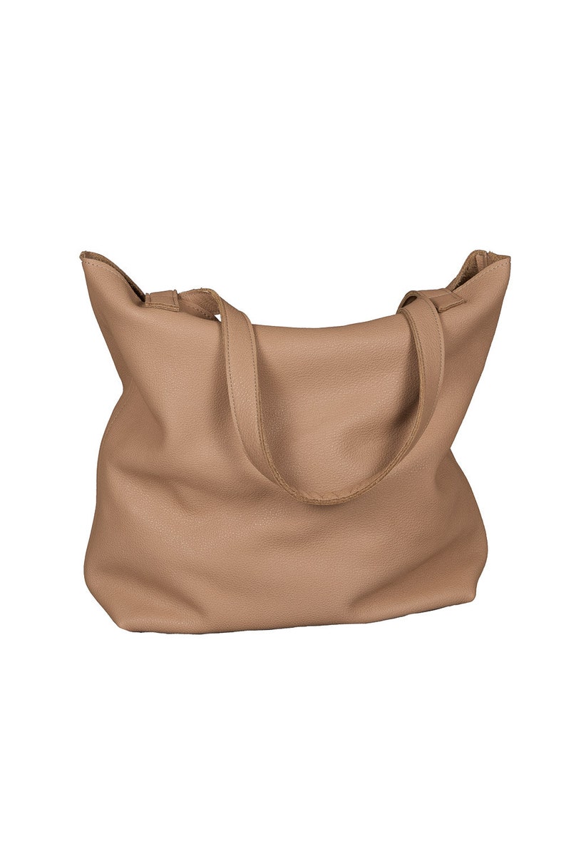 May include: A light brown leather tote bag with two shoulder straps.