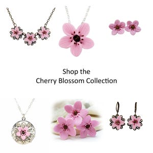 The image is a collage of various cherry blossom-themed jewelry pieces, including necklaces, earrings, and pendants.