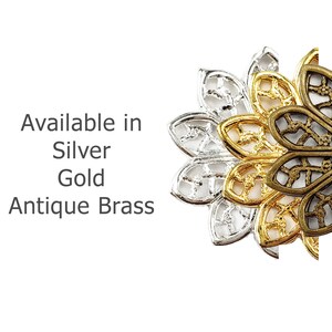 May include: Three decorative metal flower-shaped charms in silver, gold, and antique brass. Available in Silver, Gold, Antique Brass.
