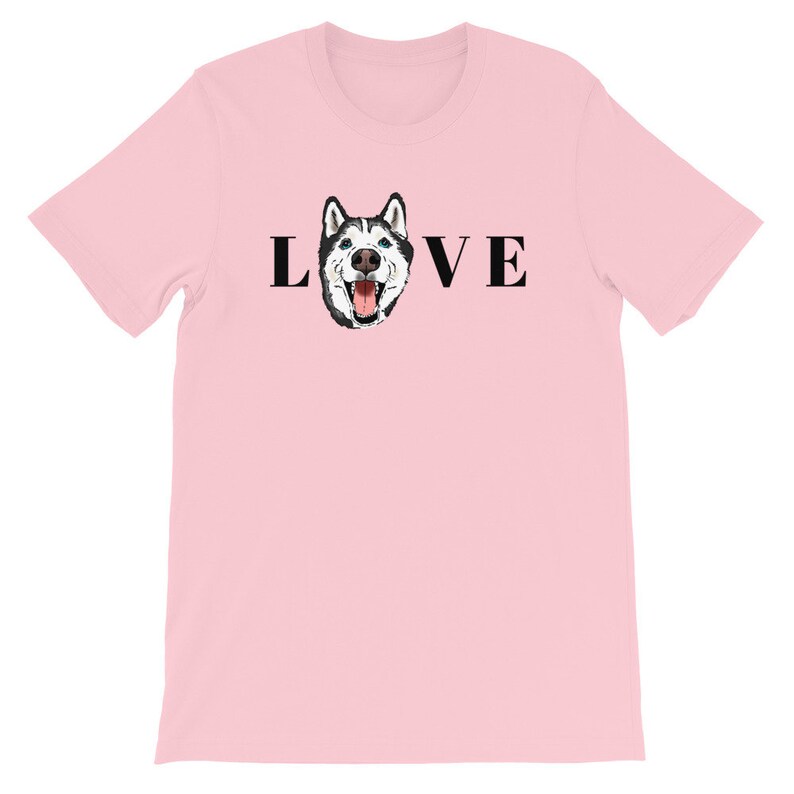 May include: Pink t-shirt with a black and white husky dog graphic and the word "LOVE" printed on it.
