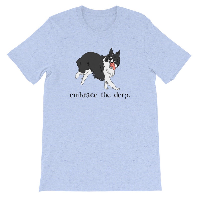 May include: Light blue t-shirt featuring a black and white illustration of a dog with its tongue sticking out. The text "embrace the derp." is printed below the dog.