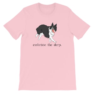 May include: Pink t-shirt featuring a black and white illustration of a dog with its tongue out. The text "embrace the derp." is printed below the dog.