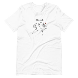 May include: White t-shirt with a black line drawing of a dog's head and the text "RESCUE." with a small red heart above the dog's head.