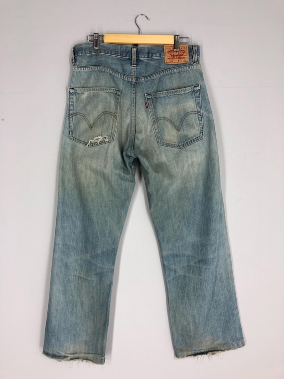 Vintage Levi's 569 Jeans: 90s Light Blue Stone Washed Ripped Denim