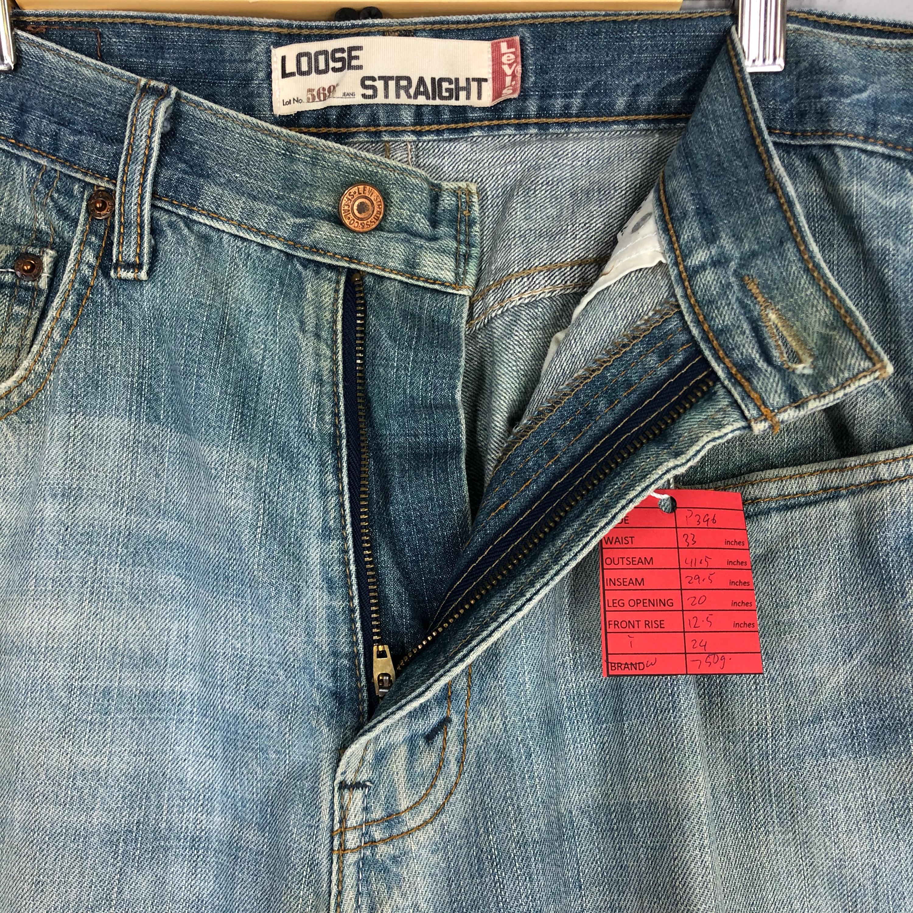 Vintage Levi's 569 Jeans: 90s Light Blue Stone Washed Ripped Denim
