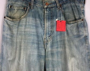 Vintage Levi's 569 Jeans: 90s Light Blue Stone Washed Ripped Denim