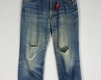 Vaqueros Wrangler vintage rasgados, denim lavado a la piedra (36x40)